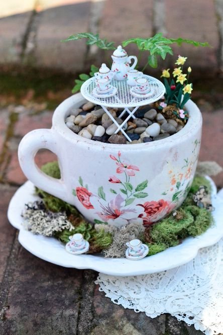DIY Fairy Garden: A large teacup and saucer  filled with styrofoam, covered with moss, pebbles, and miniature accessories becomes a place for fairies to enjoy tea and cookies | Mississippi Magazine: