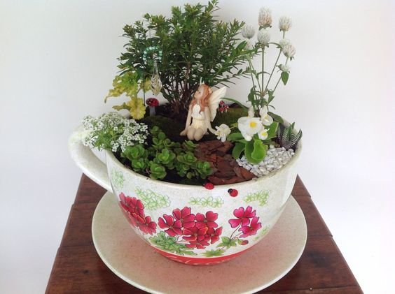 Fairy garden in a giant teacup planter: