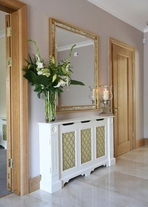 More formal entry/hallway decor ~ credenza with tall vase, fresh flowers and hurricane lamp or candle.: 